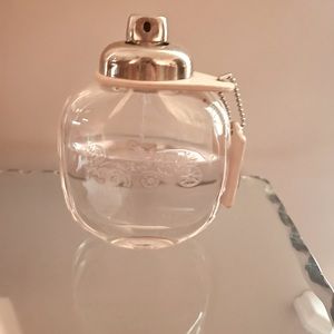 Coach Floral Eau De Parfumerie 3.0 oz Bottle is a little over half full